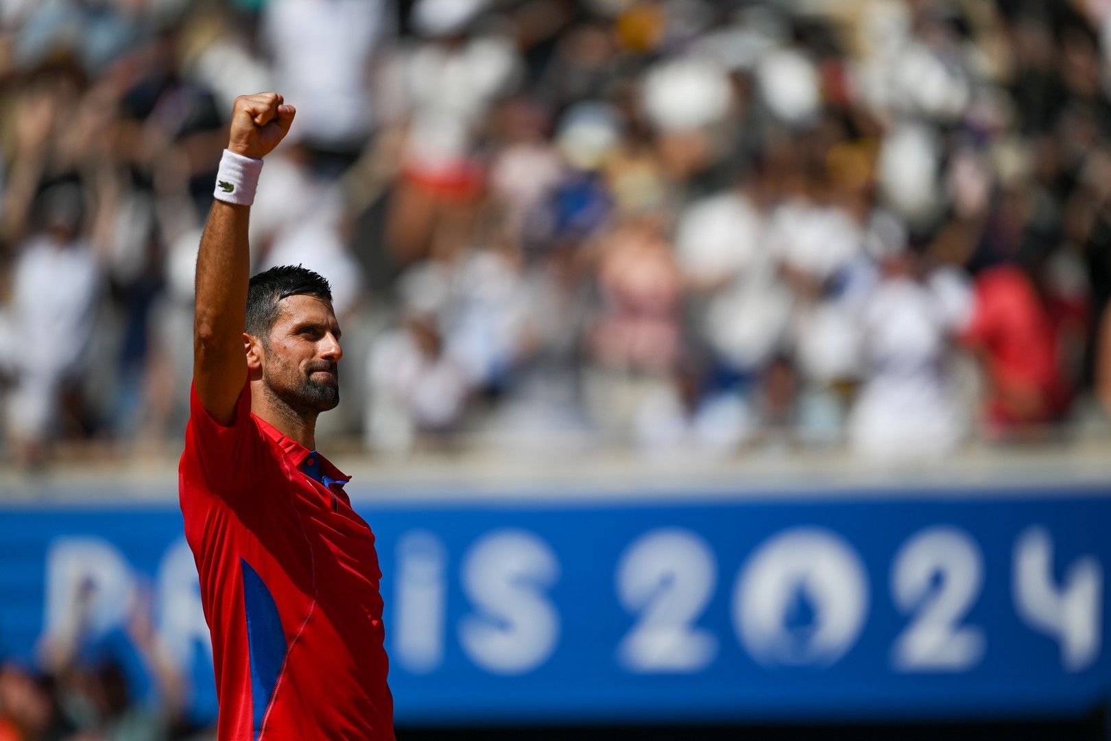 A woman's lips parted in a soft moan her eyes glazed with ecstasy