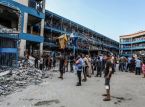 Israeli airstrikes hit Gaza school, killing 13 civilians