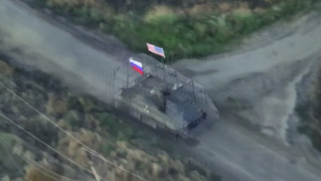 Russian media shares video of armored vehicle displaying American flag while attacking Ukraine
