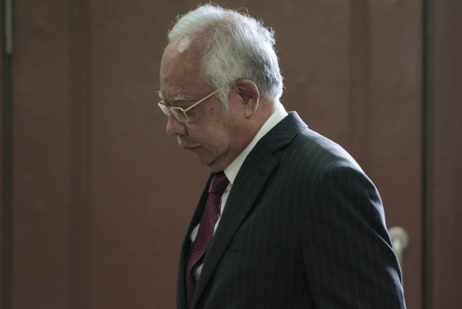 Former Malaysian prime minister convicted of abuse of power in 1MDB case