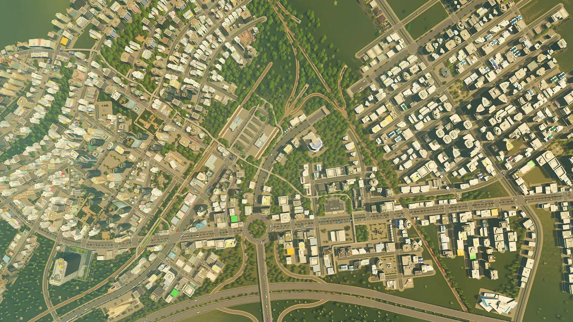 A high-angle overview of a dense city layout with roads, residential and commercial buildings in Cities: Skylines